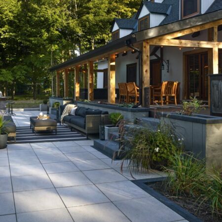 An elegant & modern patio created with Artex System Accessories provided by Hard-Co's landscape supply in Whitby